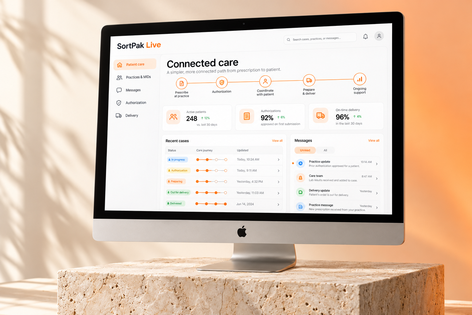 Silver Apple desktop on a travertine stone pedestal displaying an illustrative SortPak Live care portal connecting patients, doctors, and Medically Integrated Pharmacy practices